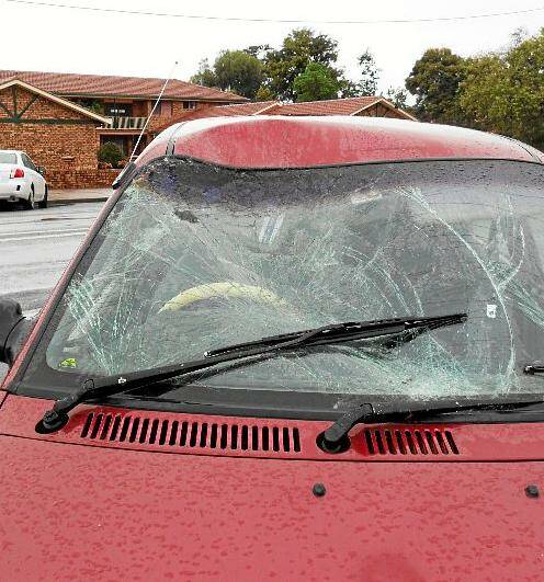 The smashed windscreen of the small car that collided with a wallaroo in Wingewarra Street.