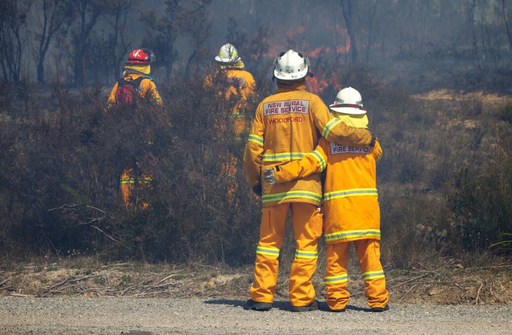 NSW RFS Crews continue to fight the State Mine fire on the Darling Causeway near Bell as they back burn onto the fire front. Photo: WOLTER PEETERS