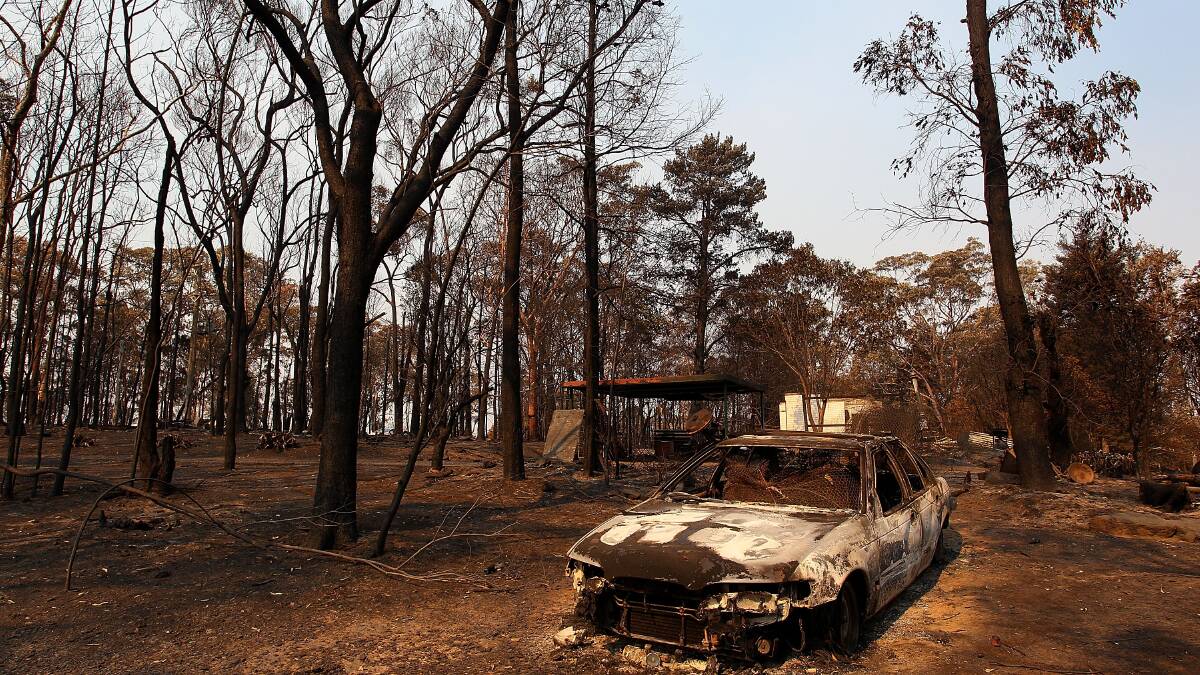 Blue Mountains residents have returned home to devastation caused by massive bushfires still raging in the area. Photo: GETTY IMAGES