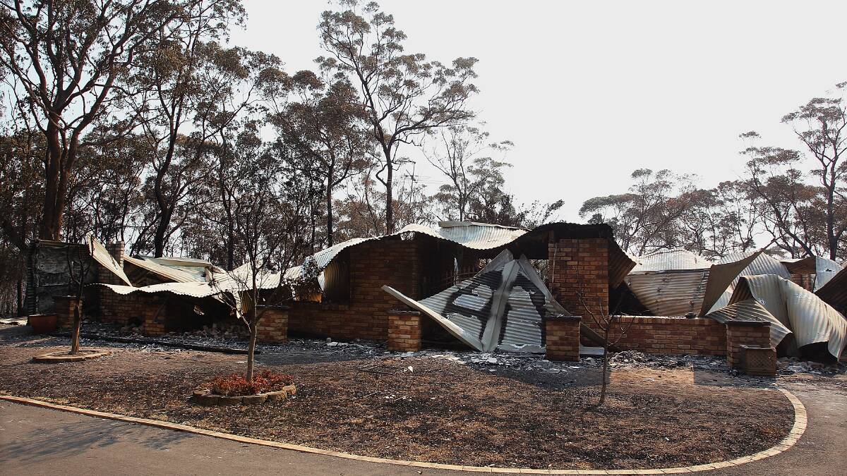 Blue Mountains residents have returned home to devastation caused by massive bushfires still raging in the area. Photo: GETTY IMAGES