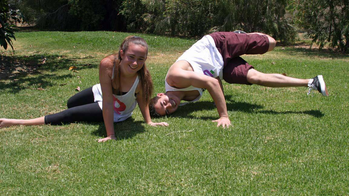 COWRA: Jordan Wong teaching United Fusion member, Brianna Hindmarch, breakdance skills that she will develop through the open workshops in February 2014.