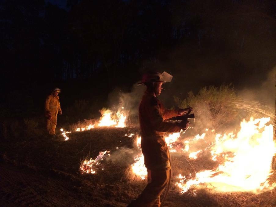 BATHURST: Firefighters battle the flames on Saturday night during the Lindon Park blaze near Perthville. Photo: BATHURST BRIGADE 011914fireLindon