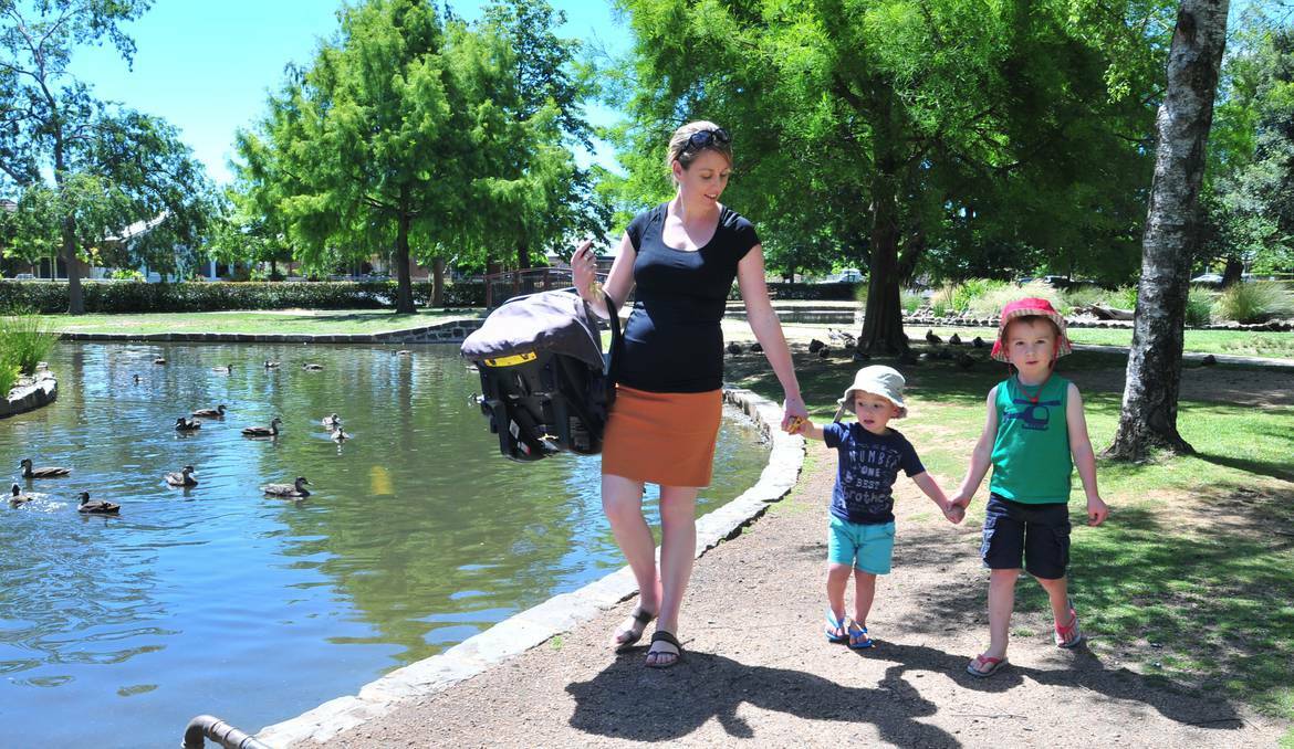 ORANGE: Mother of three Carrie Cox is calling on Orange City Council to erect signs warning people to be vigilant around Cook Park’s unfenced duck ponds after her young son fell in last week. Photo: JUDE KEOGH