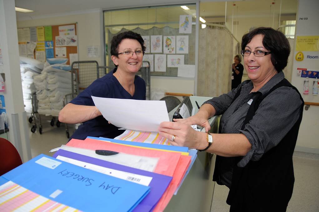 Newly-appointed director of nursing at Dubbo Base Hospital Jenny Johnston (right) confers with Carol Falcioni, nurse unit manager for day surgery. Photo: BELINDA SOOLE