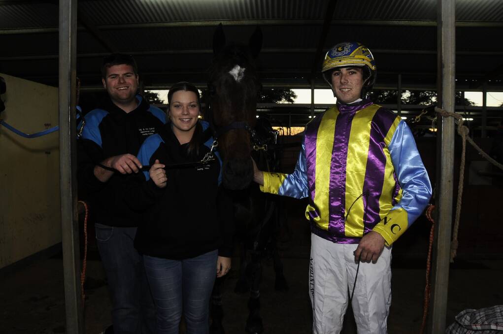 Nathan Carroll (right) with good friend Michael Dumesny and sister Erin Carroll after Bluechipboy's win at the Dubbo Paceway on Saturday night.  Photo: CHERYL BURKE