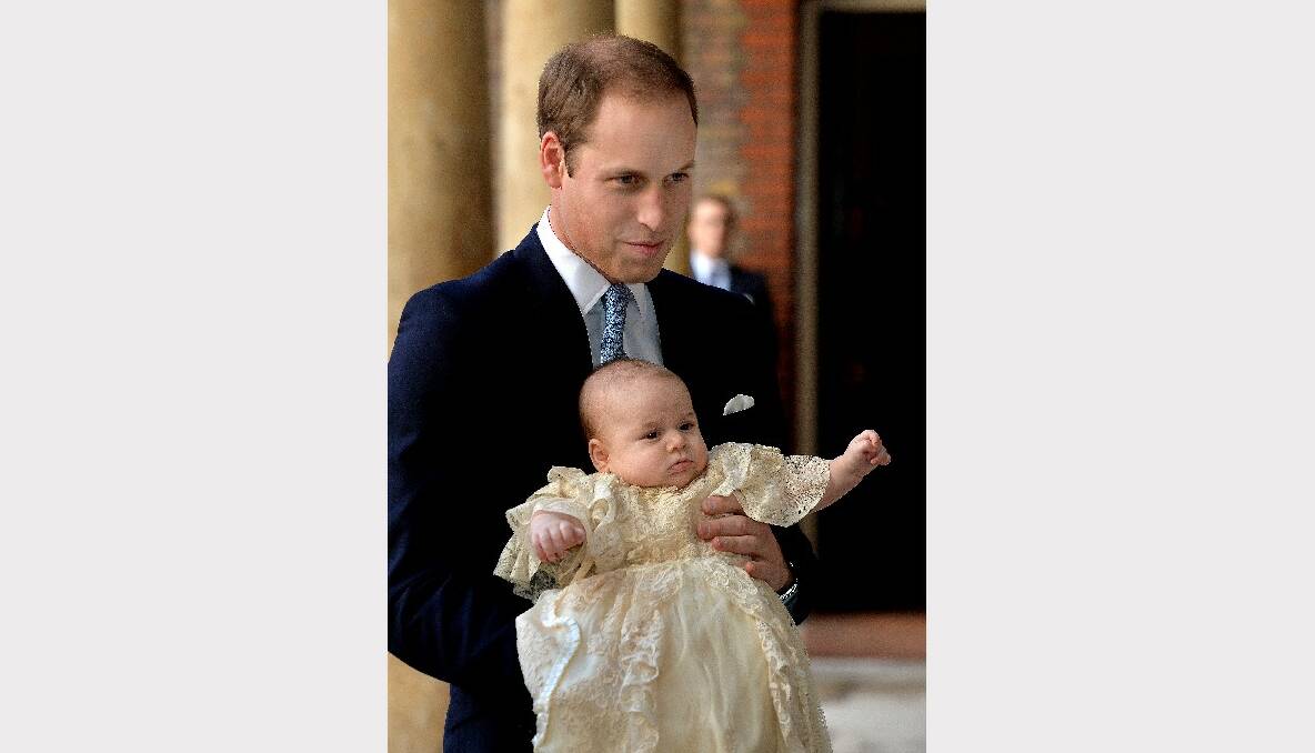 Prince William, Duke of Cambridge arrives, holding his son Prince George, at Chapel Royal in St James's Palace. Picture: Getty