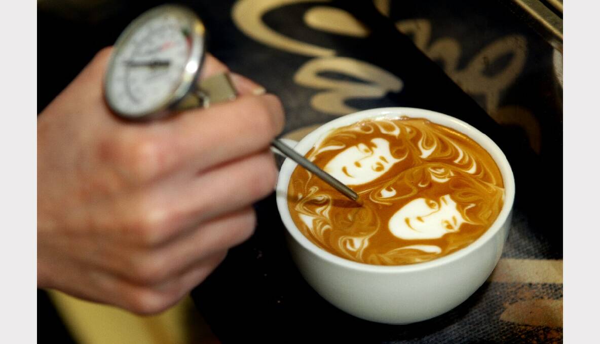 Cafe Mia barista Miray creates a portrait on the top of a coffee. 