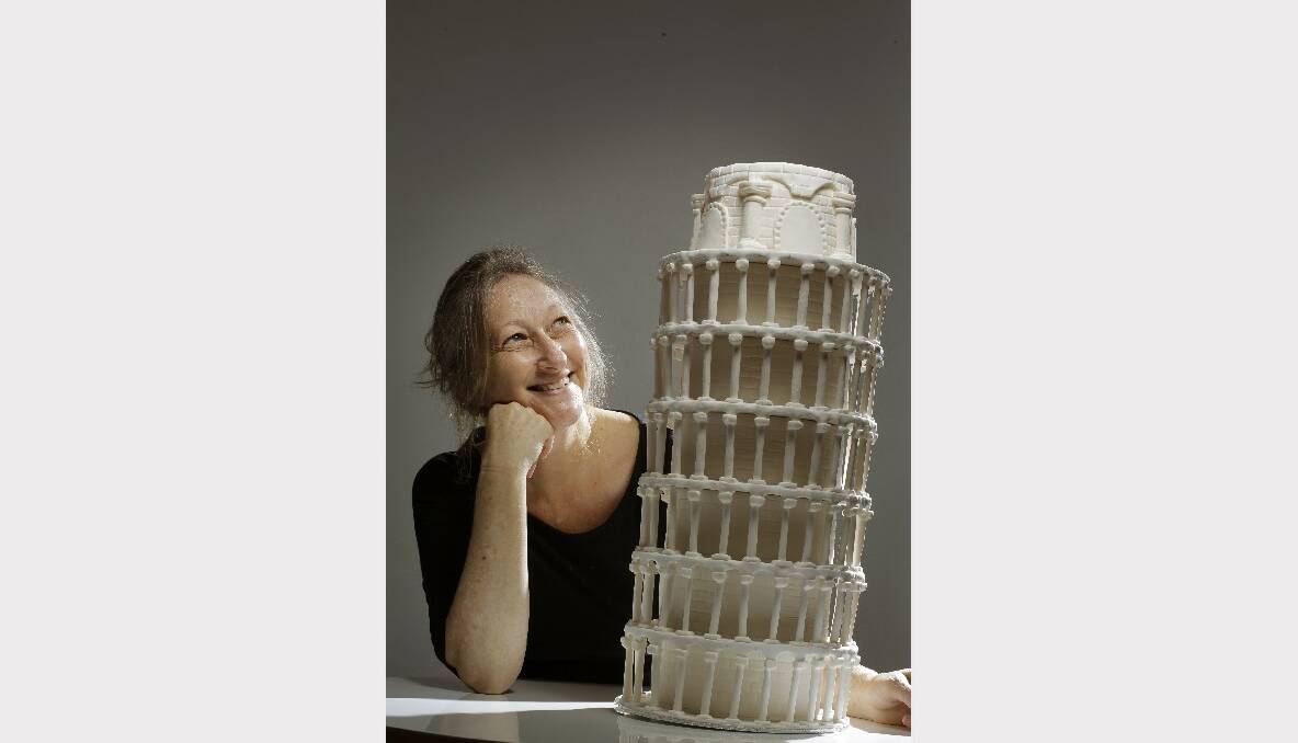 Kerrie Holmes of Sweet as with a "Leaning Tower of Pisa" cake under construction.