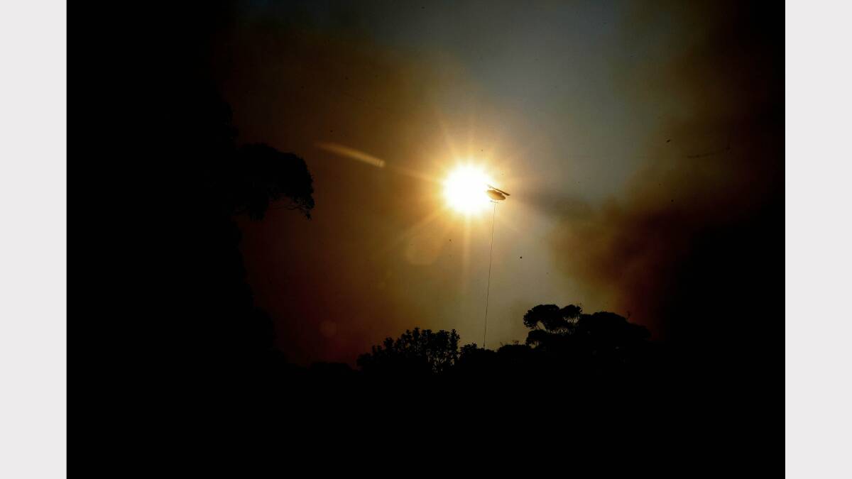  Fire at Dudley. Image shows chopper water bombing at Dudley. Picture by  Darren Pateman