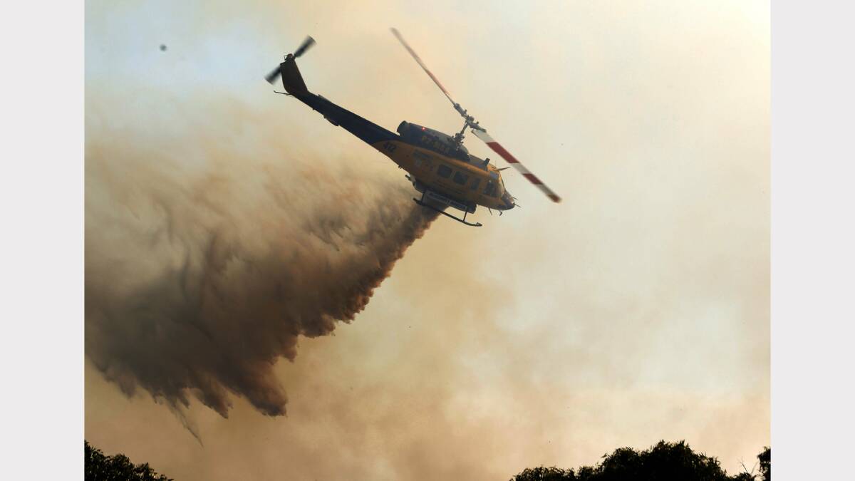  Fire at Dudley. Image shows chopper water bombing at Dudley. Picture by  Darren Pateman