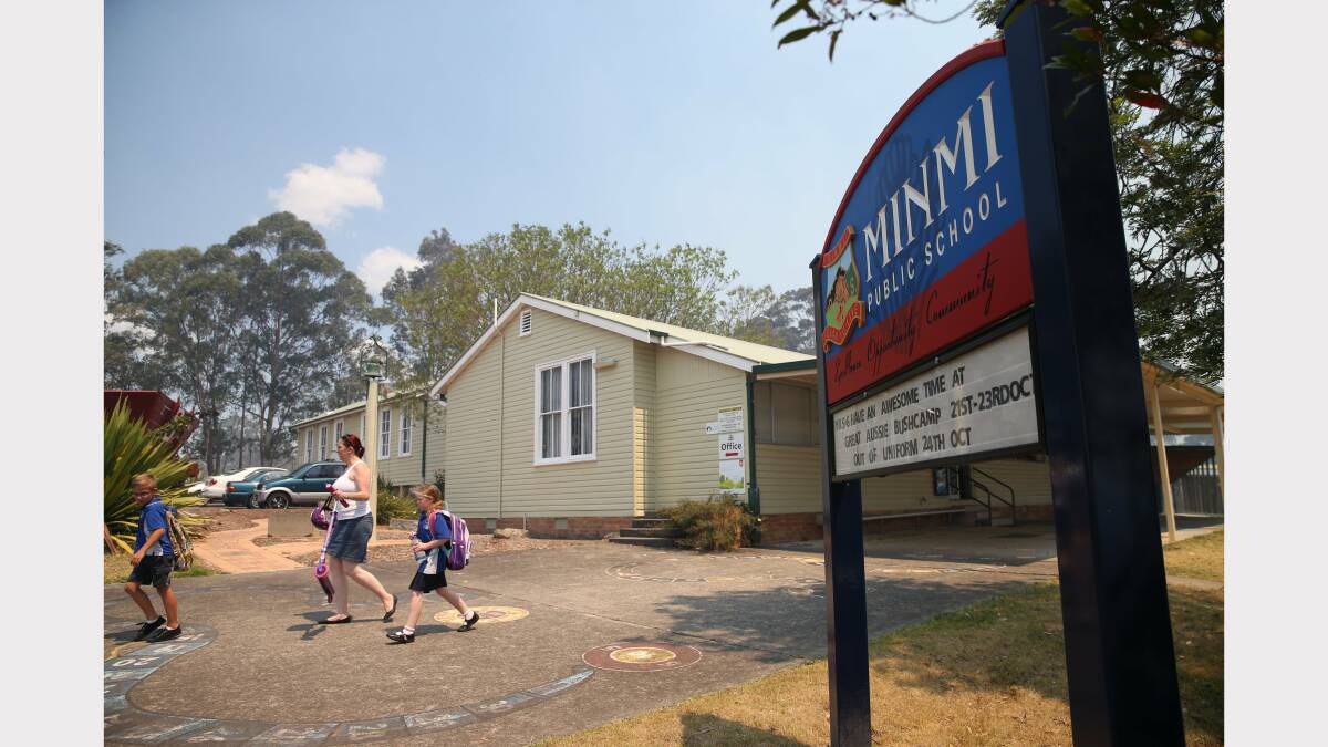  Scenes from the evacuation of Minmi Public School. Picture by Dean Osland