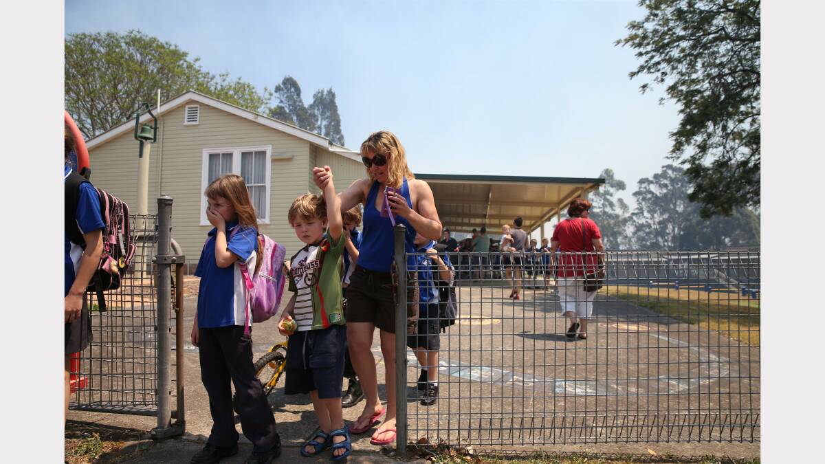  Scenes from the evacuation of Minmi Public School. Picture by Dean Osland