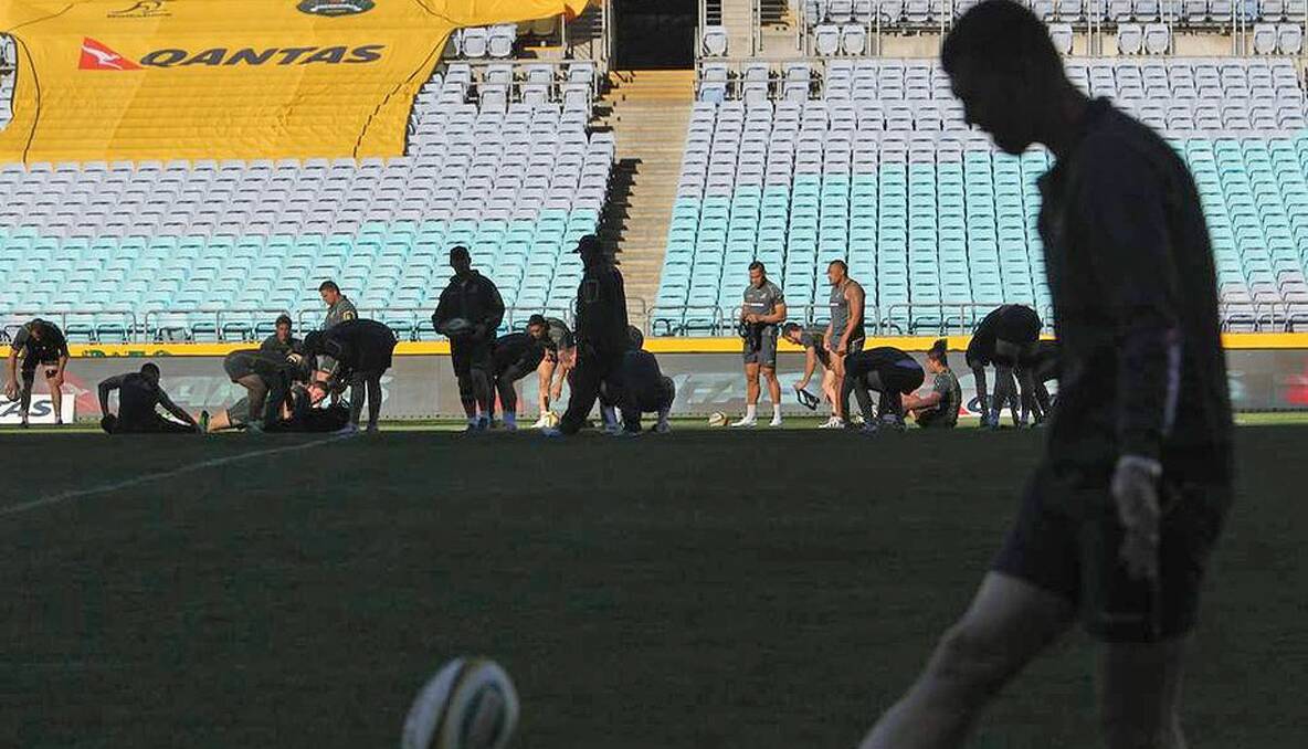 Australian Wallabies players training during the Captains run at ANZ Stadium in Sydney. Photo: Marco Del Grande 
