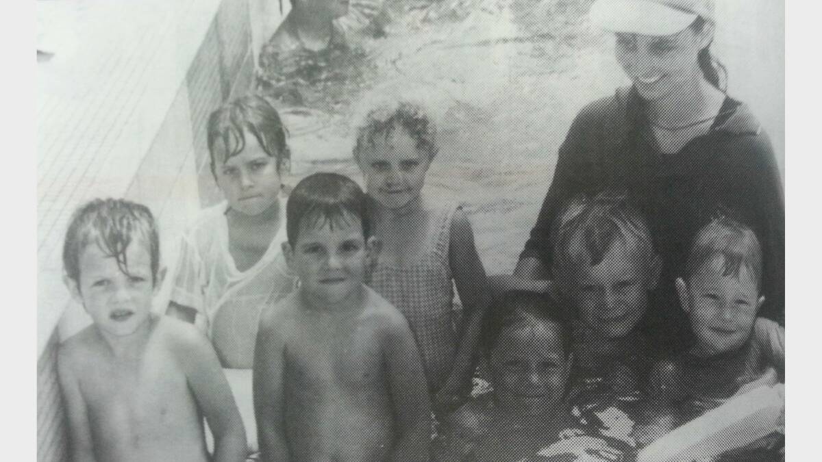 JANUARY 1993: Rhett Blaney, Michelle Barkley, Ben Mitchell, Amy Caroll, Thais Sanderson, Neal Madden and Zachary Craig under the watchful eye of swimming instructor Kristy Cooney at the Dubbo Olympic Pool. 