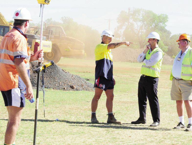Mass Group’s Terry Jones takes GPS co-ordinates while site manager John Stoddard explains the process of creating the track foundation to DDC parks and and landcare service director Murray Wood and building co-ordinator Mick Wilson at Barden Park. Photo: LOUISE DONGES