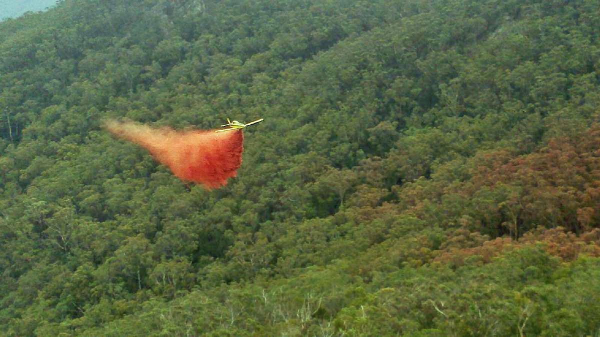 A fixed wing aircraft involved in firefighting operations has crashed near Charlie's Forest Road near Braidwood. Pictured: A light aircraft in action fighting the Wirritin blaze.