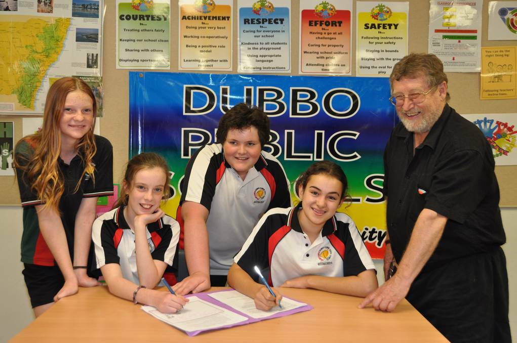 The Dubbo College debate winning team of Milla Ross, Jade Bunt, Daniel Cook and Georgia Benton-Bryant, with coach Greg Gordon. Photo: CONTRIBUTED