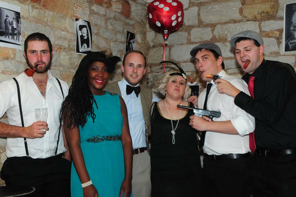 Lachie Simpson, Yvonne Muyambi, Brad Stewart, Dannielle Shuttle, Dan Wagner and Luke Taylor from the Dubbo Young Professionals Network galmmed up with accessories from the 1920s.