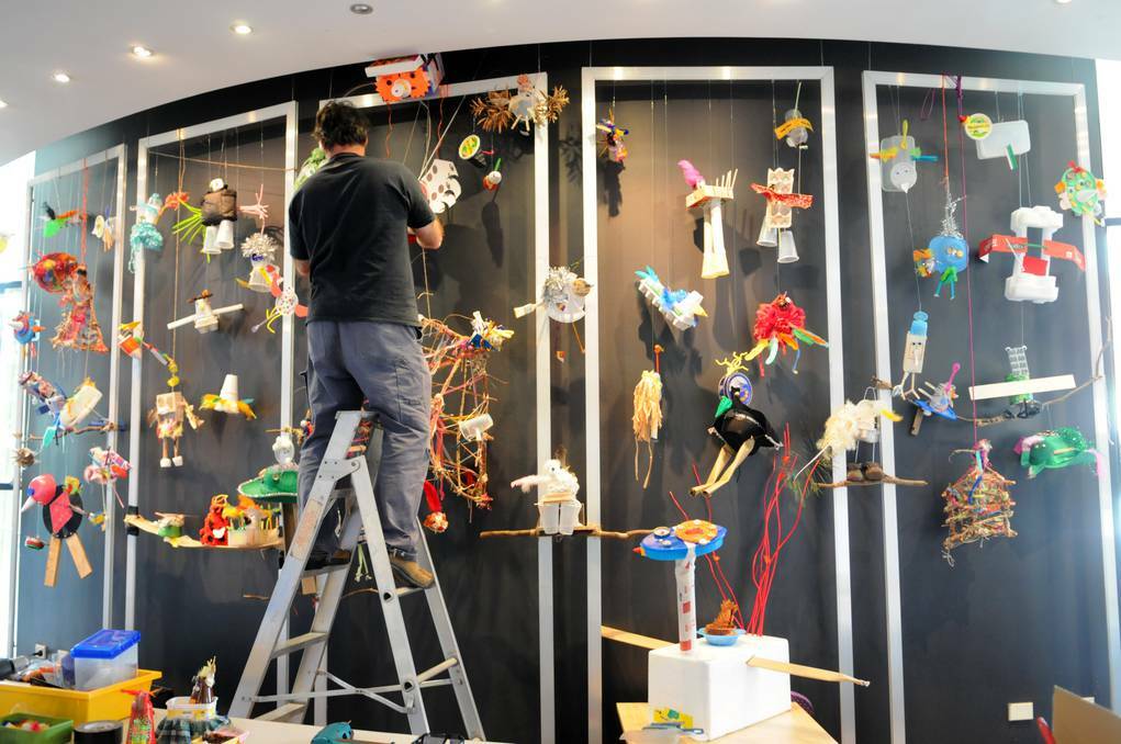 BATHURST: Students from across the region have created some extraordinary JIRBs (junk-integrated-recycled-birds) that now fill the foyer of the Bathurst Memorial Entertainment Centre with colour. Photo: ZENIO LAPKA 082613zbmec6