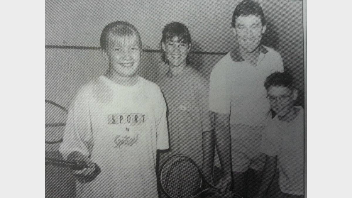 JANUARY 1993: Ray Marchant gives Lizzy Nixon (12) Tennille Marchant (12) and Jordan Marchant (8) sone squash tips. 