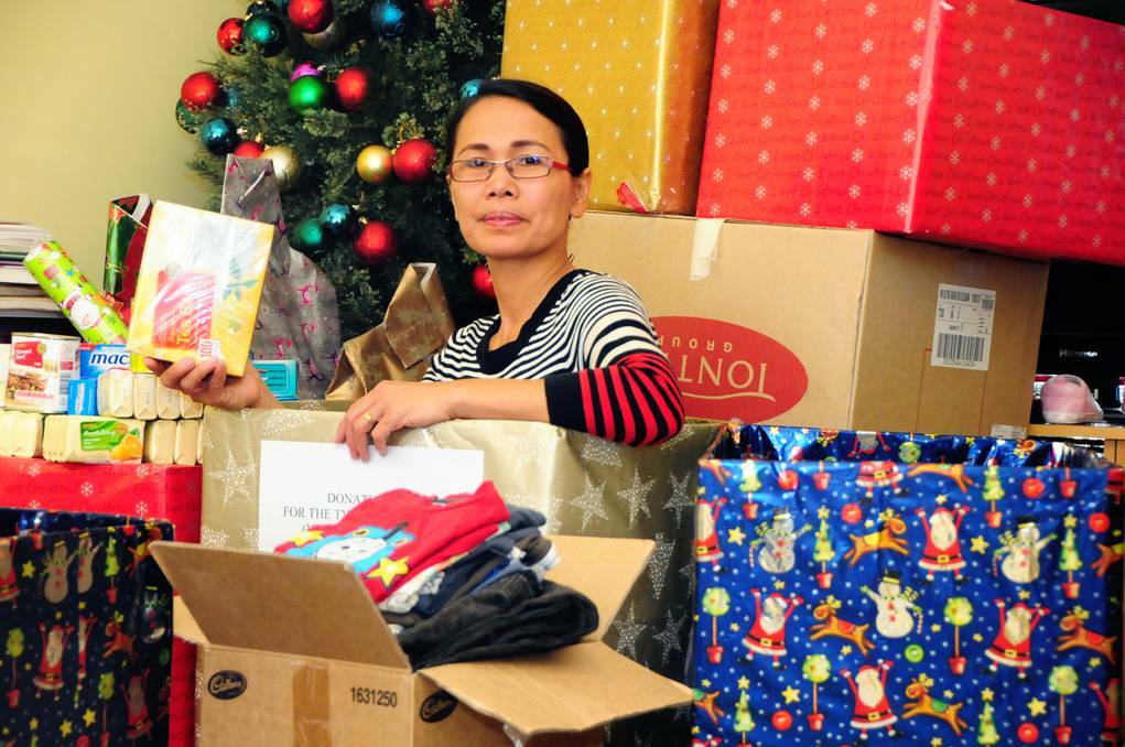 Orana Region Filipino Australian Association publicity officer Leah McKinney calls on residents to share the Christmas spirit of love and hope and donate to vicitms of typhoon Haiyan. Photo: LOUISE DONGES