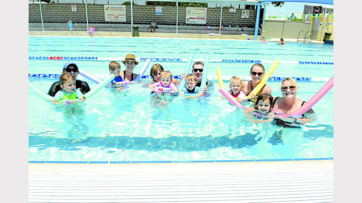 PARKES: It was not only the kids trying to stay cool at the Parkes Swimming Pool, but the parents as well - from left, Louise and Ayesha Carruthers, Tony and Kye Kinsela, Mia Smith and Kelly Thompson, Ken Middleton with Ken, Ellie O’Donoghue with Isla, and Mel ten Cate with Isabella da Silva. Photo: Renee Powell. 