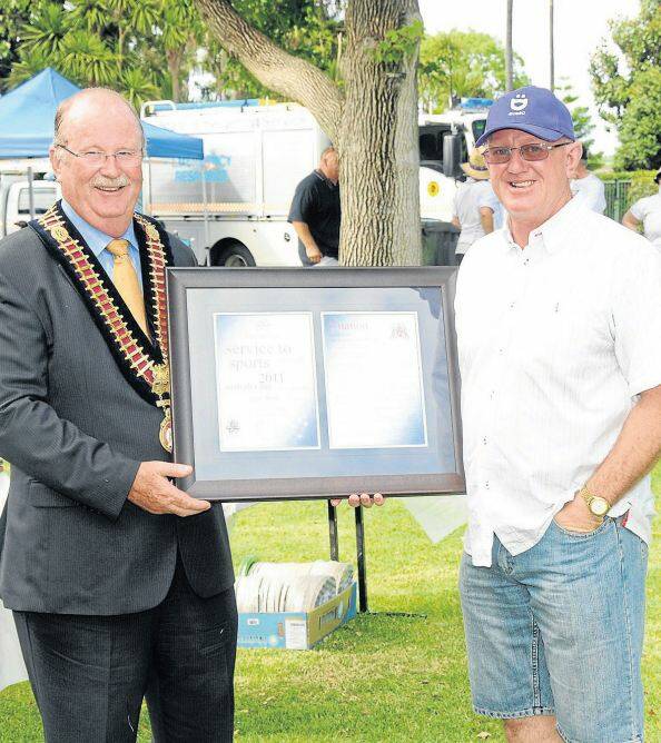 AUSTRALIA DAY HONOURS 2011: Dubbo mayor Allan Smith presents Geoff Mann with the Service to Sport Award. 