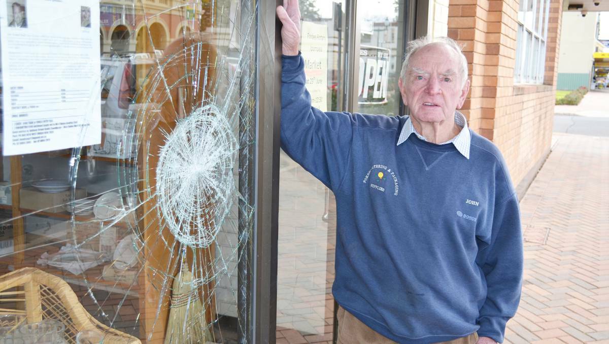 FORBES: John Lasker of Forbes Catering and Packaging was despondent after his shopfront window was broken.