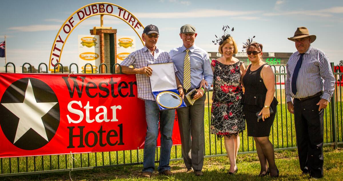 Trainer Peter Nestor was all smiles after Speedreader's win. He is pictured with Nathan and Barbara Ashley from the Western Star Hotel, his wife Nancy Nestor and Dubbo Turf Club secretary-manager Mark Day. 