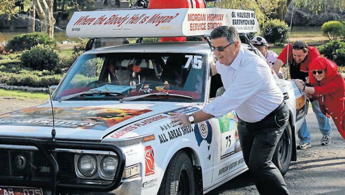 MUDGEE: Mayor Des Kennedy gives the team from Morgan, South Australia, a push at the startling line of the Great Escape on Tuesday morning.