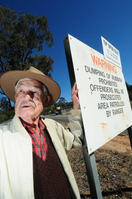DUBBO: Olly Ireland stands near a Cooba Road sign telling of the area being patrolled by rangers. Photo: LOUISE DONGES