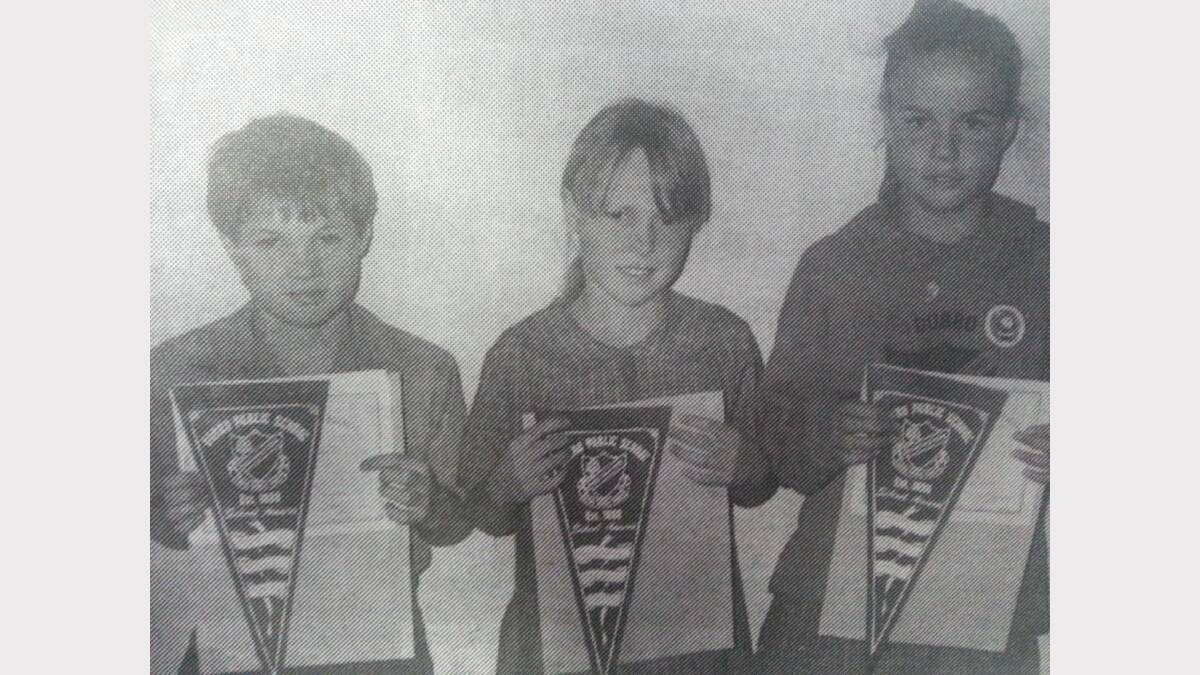 David Hill, Brianna Wheeler and Sarah Clark celebrated winning School banners at Dubbo Public School. 