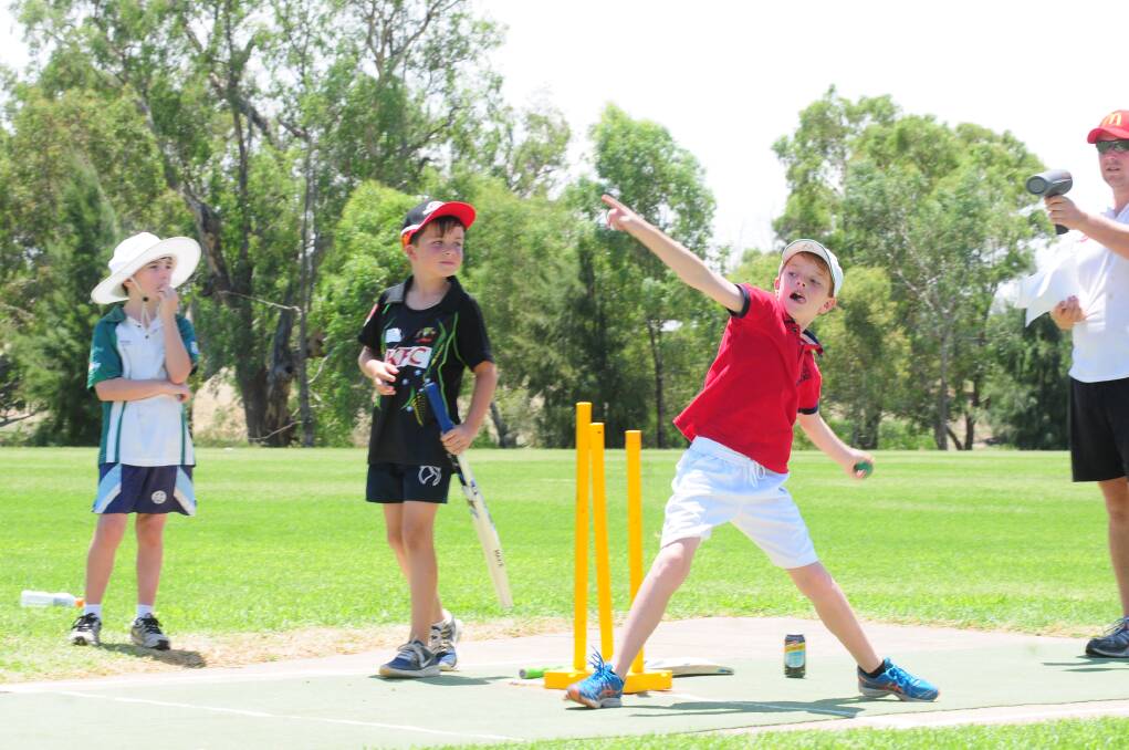 CRICKET WORKSHOP: Ted Murray has a go at bowling.  Photo: LOUISE DONGES. 