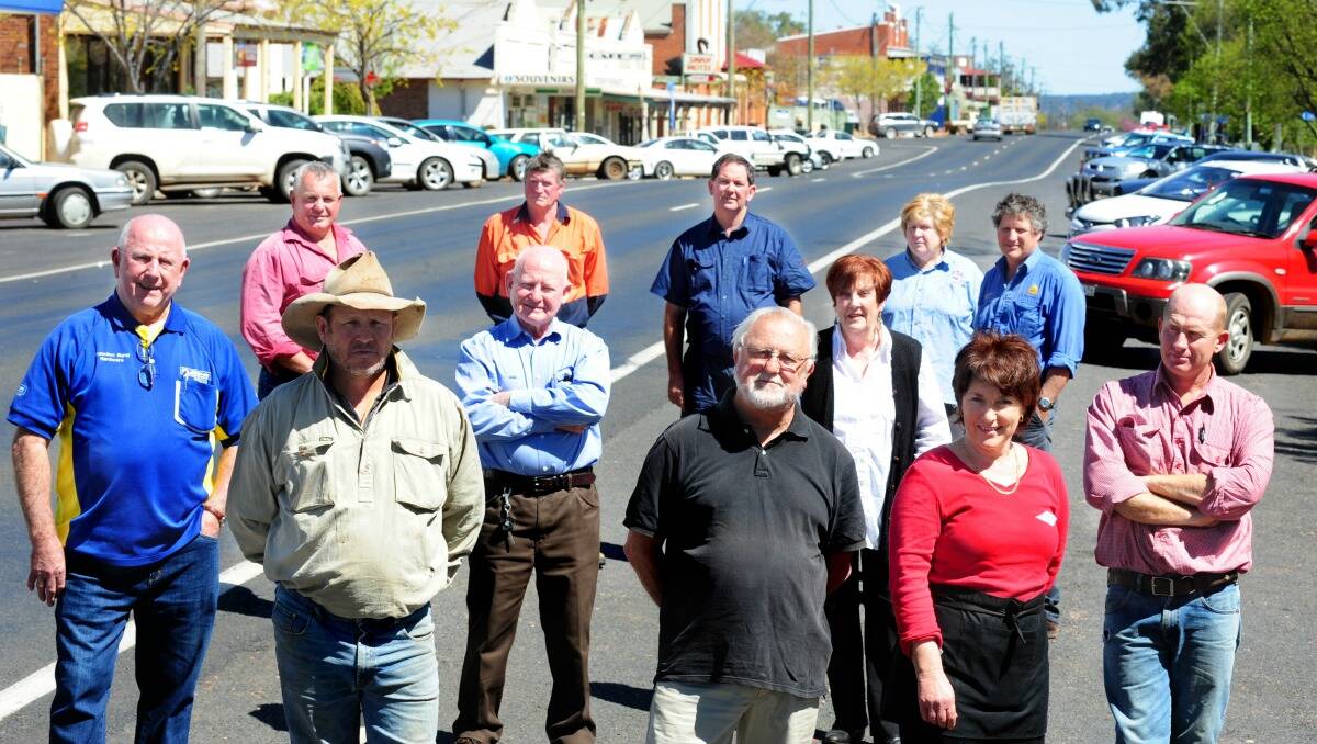Standing up for Dunedoo are (back) Murray Coe, Gene Dial, Derek Dallman, Trish Booth, Sandy Cox, (middle) Ron Gallagher, Chris Sullivan, Penny Stevens, Angus Stuart, (front) Les Carpenter, Rob Ingram and Karleeta Ryan. Photo: LOUISE DONGES