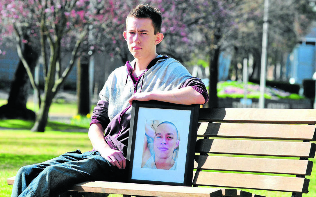 ORANGE: Adam Roberts, with a photo of his brother Damien who died by suicide, said better precautions need to be in place at Orange Health Service to protect people like his brother. Photo: JUDE KEOGH 0829roberts1