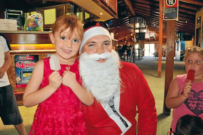 LIGHTNING RIDGE: Ellie Gough with Santa.