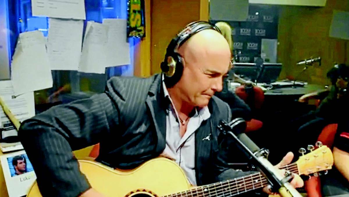 ORANGE Country singer James Blundell sings Blue in Orange last week in the 102.9FM Hot Tomato studio where the song’s writer Luke Bradnam works.