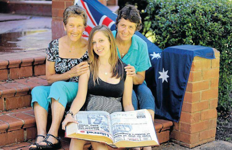 AUSTRALIA DAY HONOURS 2013: Grandmother Diana Jones, Australia Day birthday girl Sarah Rose and proud mum Raynor Jones look back at the front page of the Daily Liberalfrom 1992 which made headlines across the world. Photo: BELINDA SOOLE