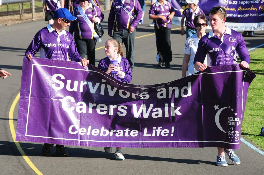 Rod Smith, Ava Smith and Brent Groves leading the Dubbo and District Relay for Life.	 Photo: HOLLY GRIFFITHS