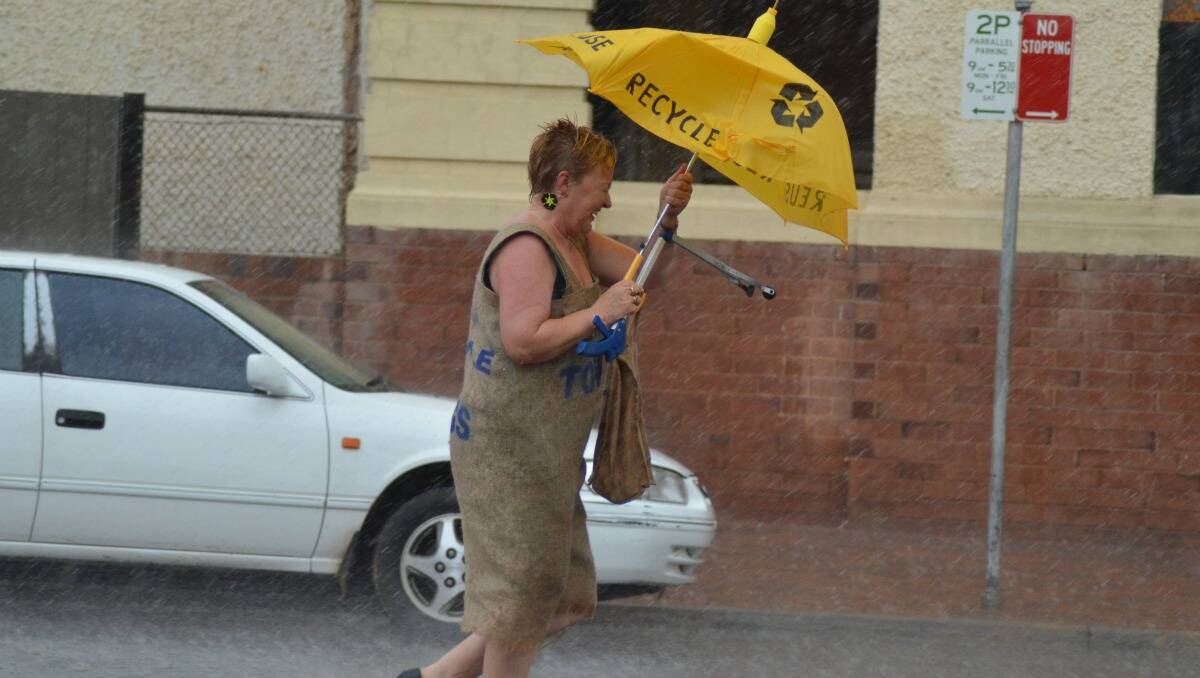 Community members were caught in the rain during the Forbes Australia Day parade. Twenty-six millimetres was recorded   at Forbes Airport on Australia Day.