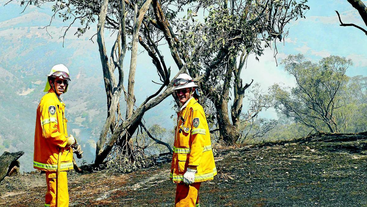 DEDICATED DUO: Father and son team Adam and Glen Griffith from Springside Rural Fire Brigade were at the Long Point fire yesterday, the fire has spread to 284 hectares of inaccessible terrain. 0102longpt8