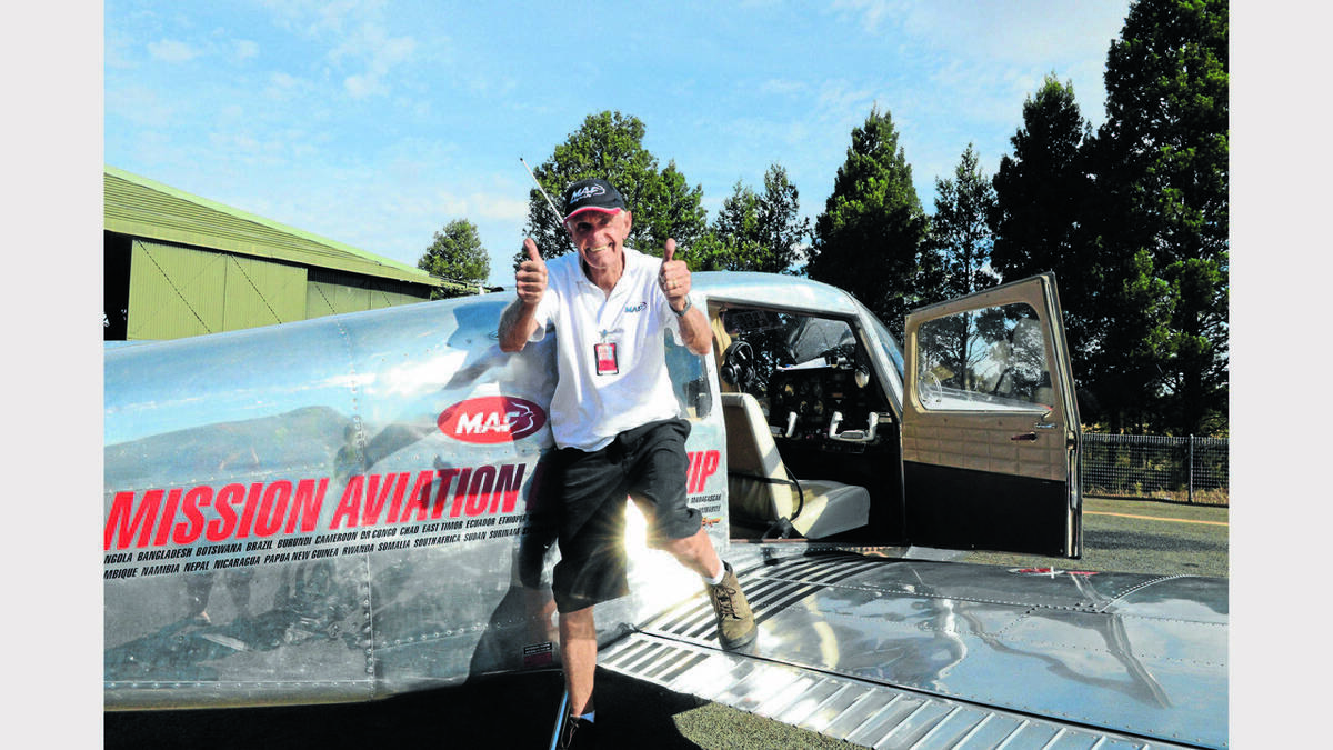 Tired, but elated...Ron Watts steps out of his plane after 10 gruelling hours setting his Australia flights record.