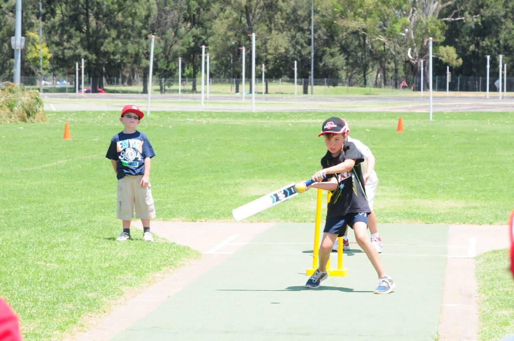 CRICKET WORKSHOP: Josh Bywater has a go at batting. Photo: LOUISE DONGES. 