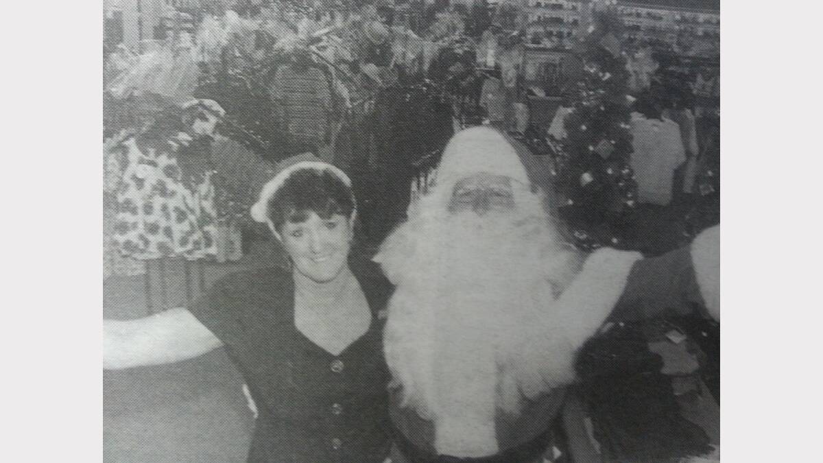 It's the time of year for Santa to celebrate, and he welcomed customers to Grae Bros with employee Sandy Lehmann