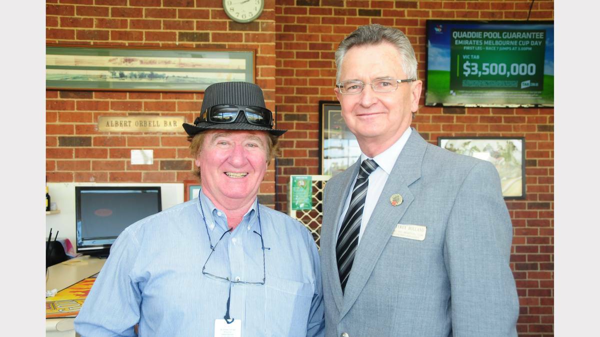 Enjoying Melbourne Cup at Dubbo Turf Club were Gary Pierpoint and Geoffrey Holland.