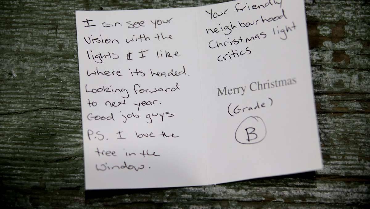 GRADE B: Glenn and Jo Currington of 47 Kenley Crescent Macquarie Hills, received this note from the Friendly Neighbourhood Christmas Lights Critic.