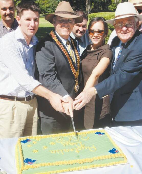 AUSTRALIA DAY HONOURS 2008: Mayor Greg Matthews cuts the Australia Day cake with award winners Andrew Rose, Vanessa Uebergang and Brian Semmler.