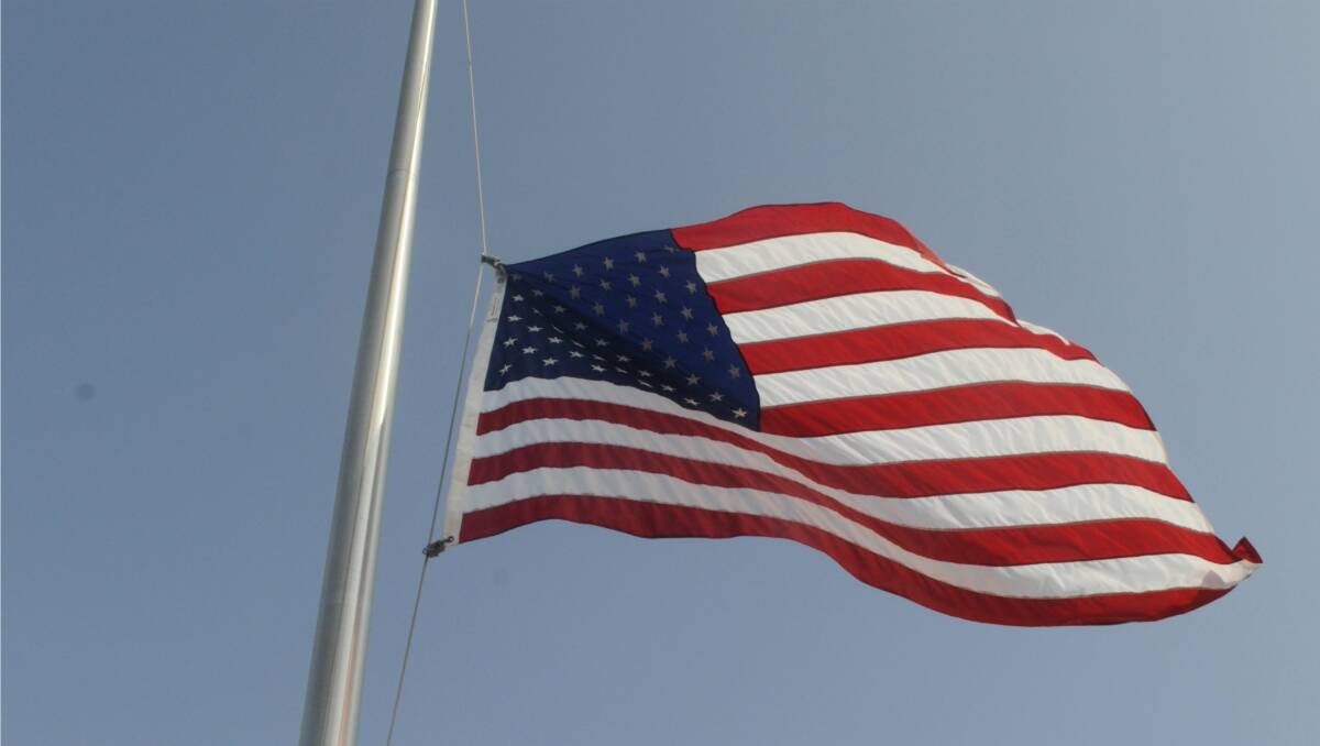 An American flag flies at half-mast in Dubbo as a sign of respect for the lives the terrible tragedy has touched. File Photo
