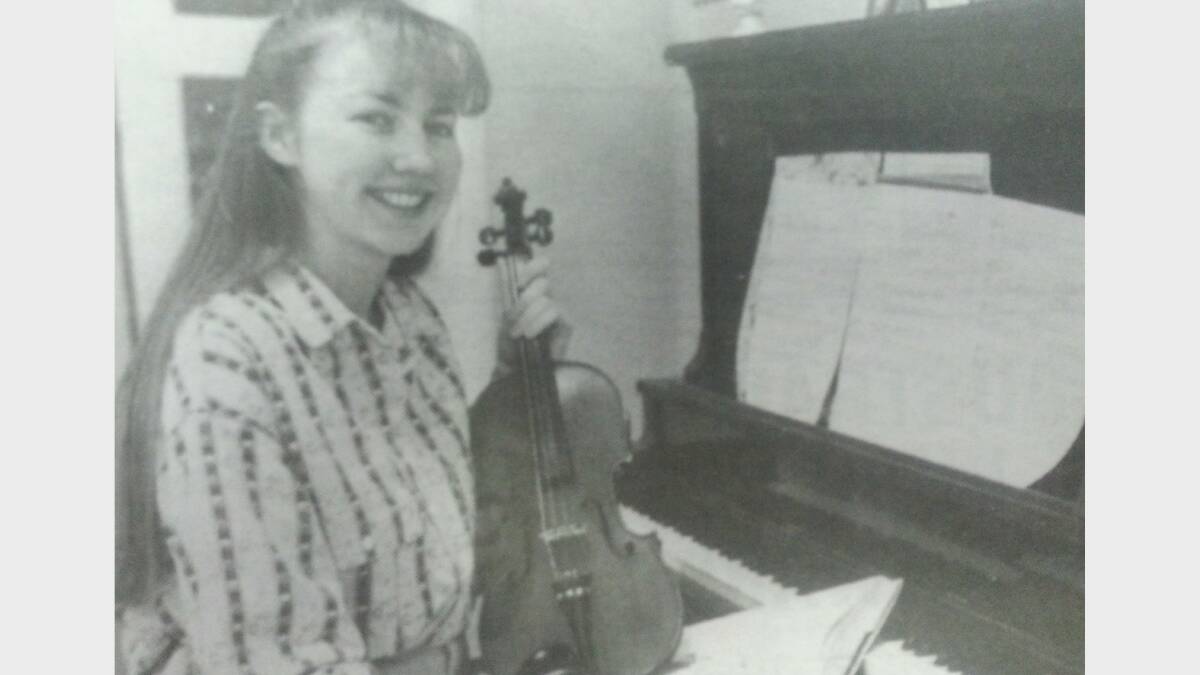JANUARY 1993: Jane Bennett, Dubbo's top HSC achiever in 1991 with her tools of the trade and doing what she knows best, making music. 