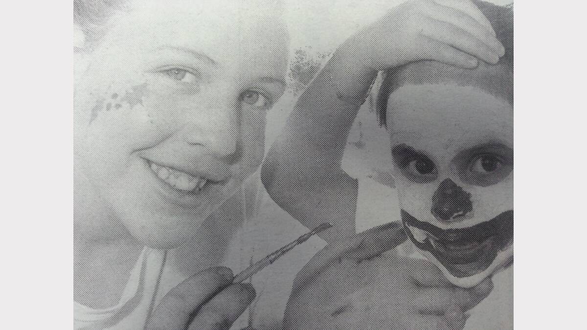 Dubbo Apex Club celebrated with the Venetian Carnival. Pictured Cathy Blundell (14) paints the face of Jessica Carrett (5). 